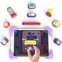 A person holding an iPad displaying the text "Build 30 3D gadgets using real figures" for Tacto Electronics by PlayShifu.