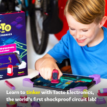 A person holding an iPad featuring the text "Build 30 3D gadgets using real figures" for Tacto Electronics by PlayShifu.